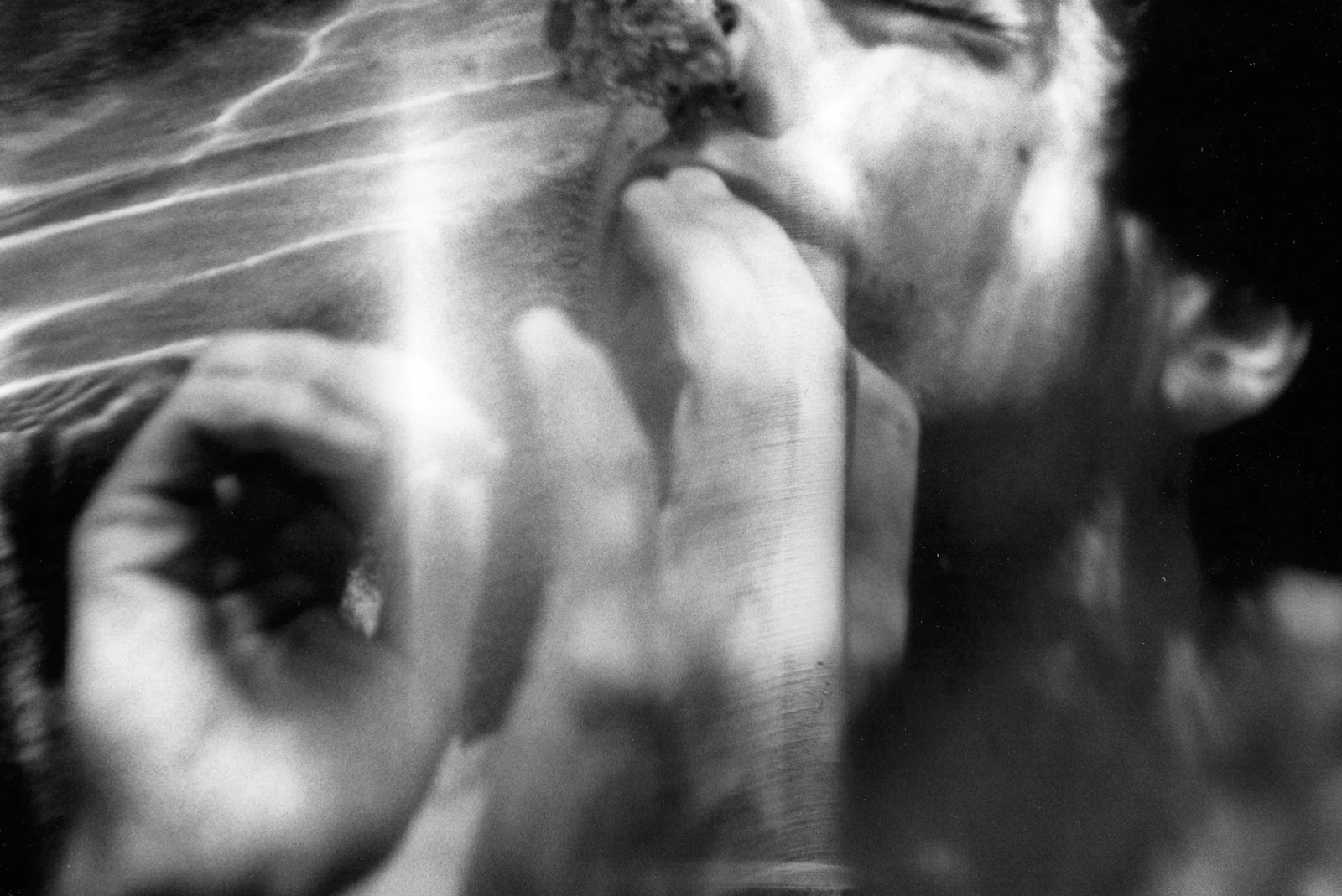 An underwater portrait with wavering reflections