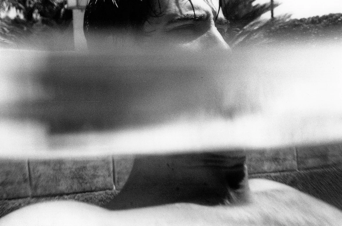 A portrait split by the waterline